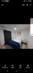 ein Bild eines Schlafzimmers mit einem Bett in der Unterkunft Centric and cozy apartment in Punta Cana