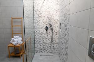 a shower in a bathroom with a glass door at Ki.Kos - Private House in Kos +24 photos