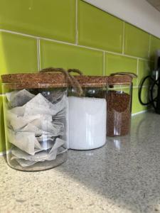 a jar filled with paper sitting on a counter at Entire house in Liverpool in Litherland