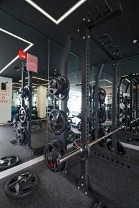 a gym with a bunch of equipment in it at Beautiful floor 9th apartment Pool Gym Barranco in Lima