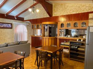 a kitchen and dining room with a table and chairs at Hostal Solor in San Pedro de Atacama