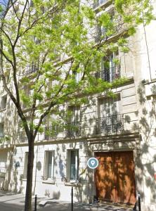 an apartment building with a large wooden door at Paris 16 lux and cozy 2 bedroom in Paris