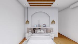 een slaapkamer met een bed in een witte kamer bij adma hotel in Paje