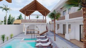 een villa met een zwembad en palmbomen bij adma hotel in Paje
