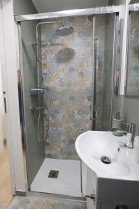 a bathroom with a shower and a sink at Maison Sara in Bari