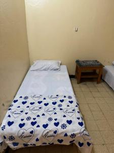 Säng eller sängar i ett rum på Addis Guest House Djibouti