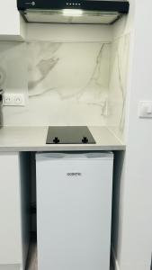 Kuchyň nebo kuchyňský kout v ubytování Nid Cozy - zone historique de Clermont Ferrand + 7 fotografií