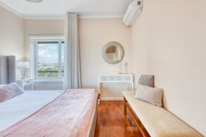 a bedroom with two beds and a window at Candal Douro in Vila Nova de Gaia