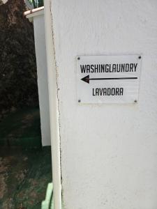 a sign on a building that reads washing terminologyluaj at Casa Lara in Hermigua