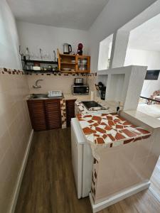 a kitchen with a sink and a counter top at Casa Lara in Hermigua