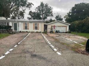 a house with a driveway in front of it at Green #23 in Northbrook