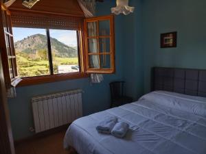 Rúm í herbergi á Hotel Pico Espiguete