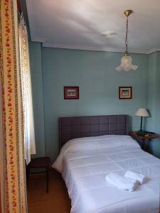 Rúm í herbergi á Hotel Pico Espiguete