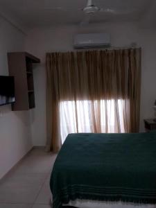 Postel nebo postele na pokoji v ubytování Bait Corrientes I