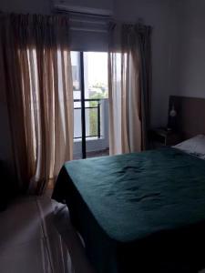 Postel nebo postele na pokoji v ubytování Bait Corrientes I + 2 fotografie