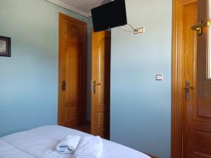 Rúm í herbergi á Hotel Pico Espiguete