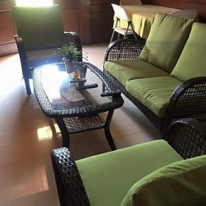 a living room with a couch and a coffee table at Resort Nabruni in Belas