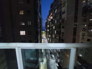 a view of a city street at night from a balcony at Book Santos - Estanconfor 708 - 2 quartos in Santos