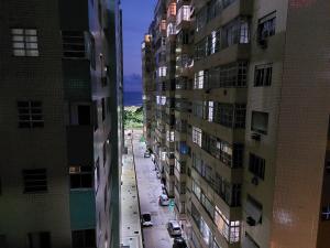an overhead view of a street between two tall buildings at Book Santos - Estanconfor 708 - 2 quartos in Santos