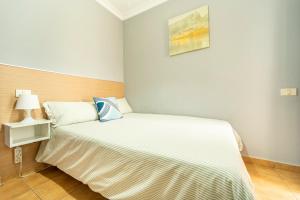 a bedroom with a large white bed in a room at El Secreto del Norte in Las Palmas de Gran Canaria