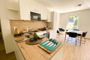 a kitchen with a table and a counter top at 230 Lux Furnished flat in Beaufort