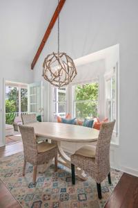 a dining room with a table and chairs at Sawyer's Landing- Mins to beach & Dtwn in Charleston