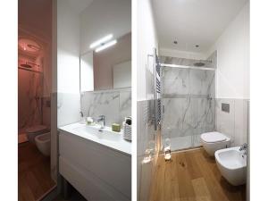 uma casa de banho com um chuveiro, um lavatório e um WC. em Luxury Loft Marghera em Milão