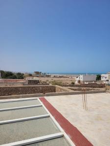 a view from the roof of a building with two tennis courts at Ash in Essaouira