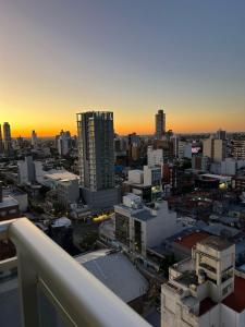 a view of a city at sunset from a building at Departamento Rivadavia in Santa Fe