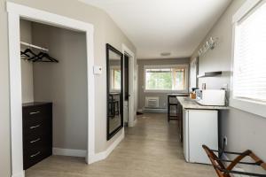 a kitchen with a sink and a counter top at Crawford View in Kelowna