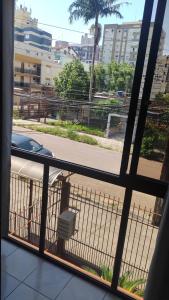 a view of a street from a balcony at Próximo ao Consulado - Quarto Inteiro in Porto Alegre