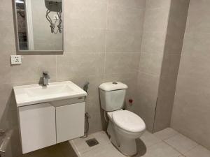 a bathroom with a white toilet and a sink at 2 bhk apartment available in Al qasmiyah Sharjah in Sharjah
