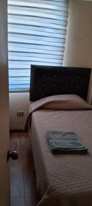 Llit o llits en una habitació de Full departamento cerca del Movistar Arena