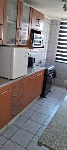 Kitchen o kitchenette sa Full departamento cerca del Movistar Arena