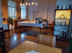 a room with a table with food on it at Hotel Germânico in Agudo