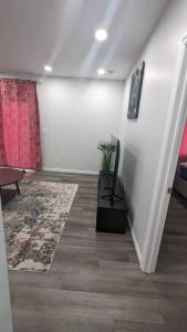 a living room with a couch and a table at Comfy one bedroom Airdrie in Airdrie