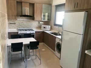 Η κουζίνα ή μικρή κουζίνα στο Um Uthaina Place +4 φωτογραφίες