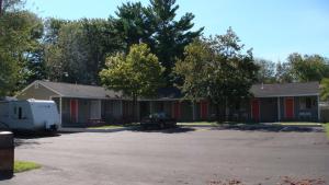 a group of houses with a parking lot at Beachway Motel in Salisbury