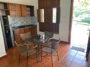 a kitchen with a table and chairs in a kitchen at Hacienda La Tulia Eco Hotel in Toro