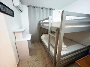 a small room with two bunk beds in it at Casa Doña Guilla 2 