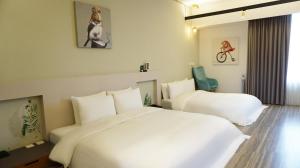 Letto o letti in una camera di Thinker Hotel