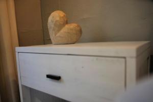 a heart statue sitting on top of a dresser at Miami - Brickell - Beaches in Miami