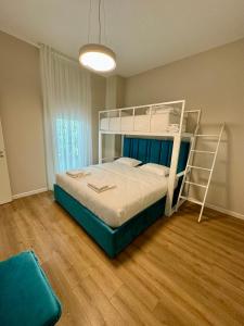 a bedroom with a bunk bed with a ladder at Villa Splendid Palase in Himare