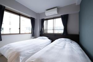 Postel nebo postele na pokoji v ubytování 城崎温泉 HOSTEL Waraku