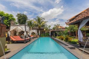 an image of a swimming pool at a villa at Pondok Kutuh Guest House in Ubud