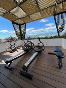 two exercise bikes sitting on a wooden deck at Getaway near Airport in Guatemala