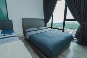a bedroom with a bed and a large window at Southkey 2BR, 5-6 PAX, WIFI, Mid Valley JB, in Johor Bahru