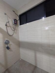 a shower stall in a bathroom with a window at Casa el Huasteco ! in Escazu