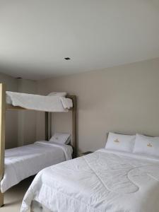 Letto o letti in una camera di Hotel Ocean Fusagasuga