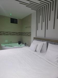Letto o letti in una camera di Hotel Ocean Fusagasuga